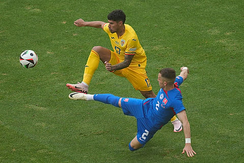 Peter Pekarik and Florinel Coman battle for the ball